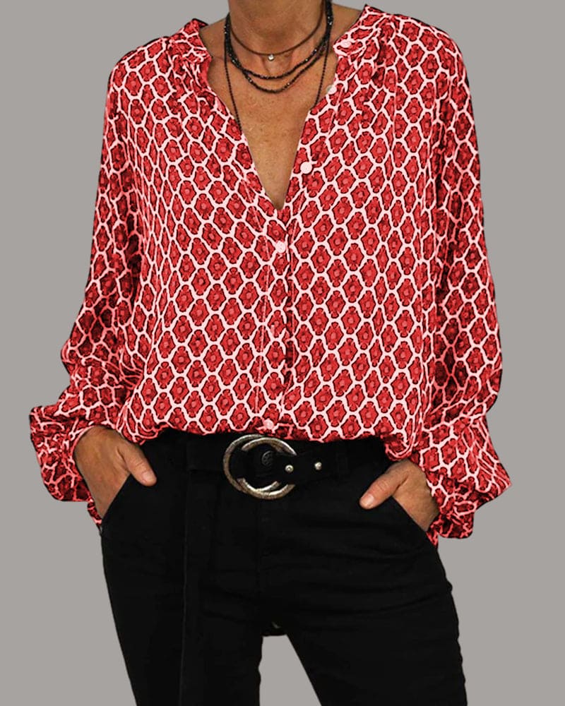 Stilig langermet bluse for kvinner med moderne geometrisk design og flatterende V-hals. Elegant stil.