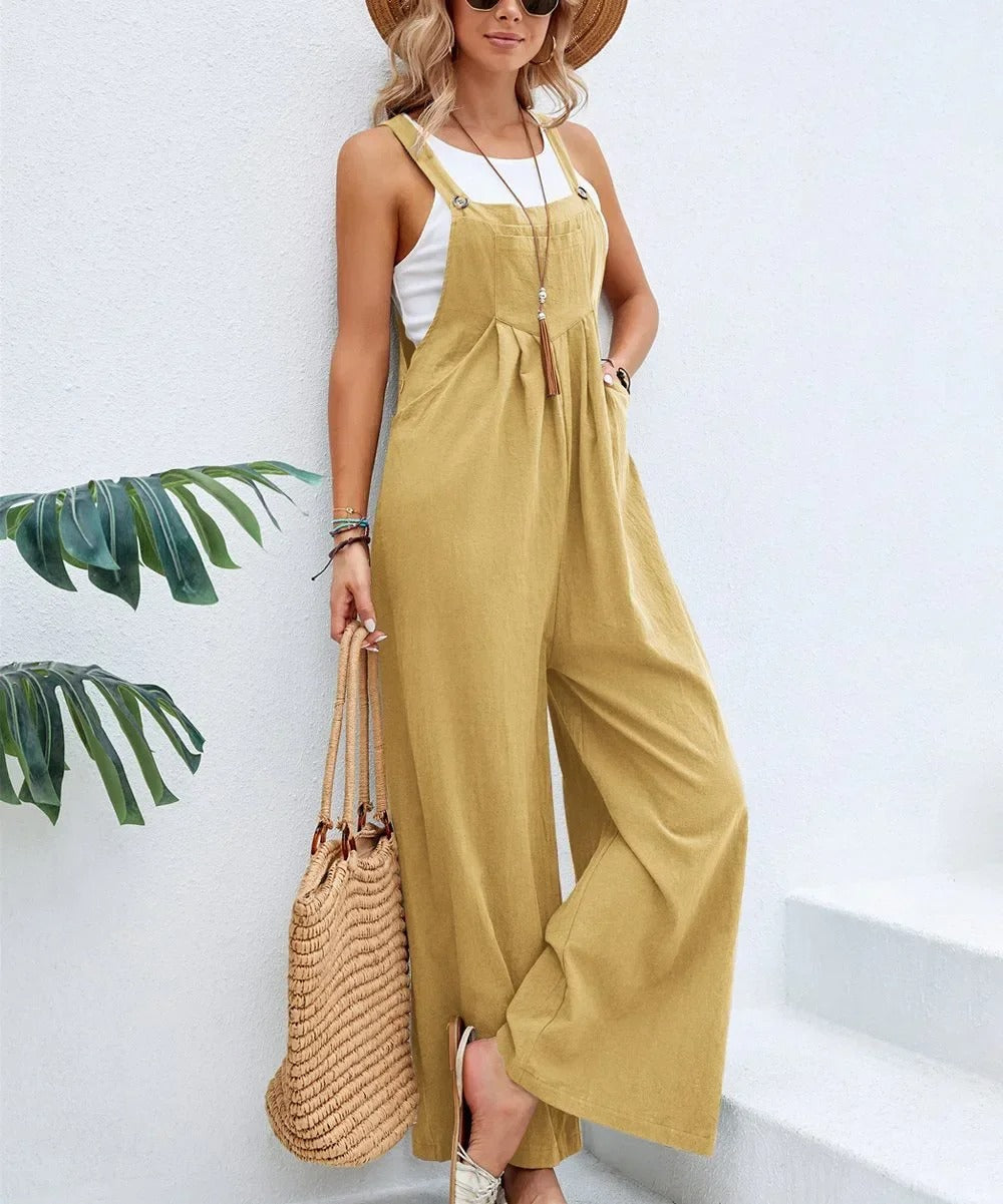 Løs passform kvinners baggy bib jumpsuit med brede ben. Komfortabel og chic for casual sommerdager.