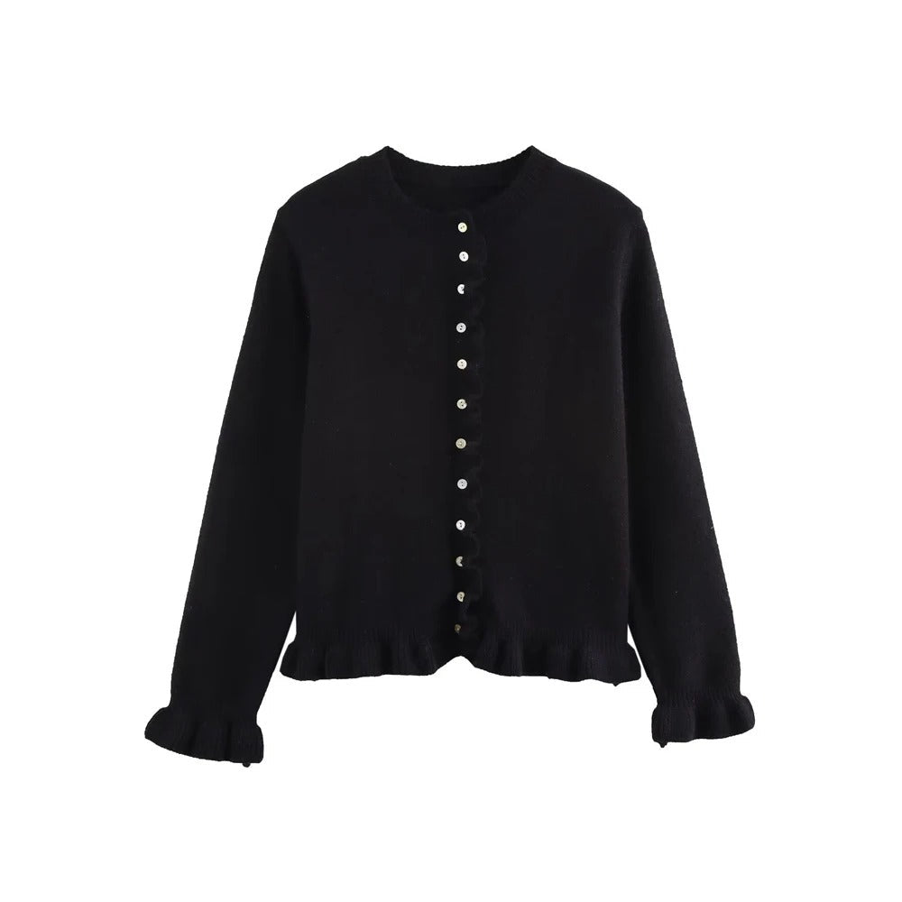 Stilfull kvinne iført en myk, strikket cardigan, perfekt for lagpålag stil i mote.