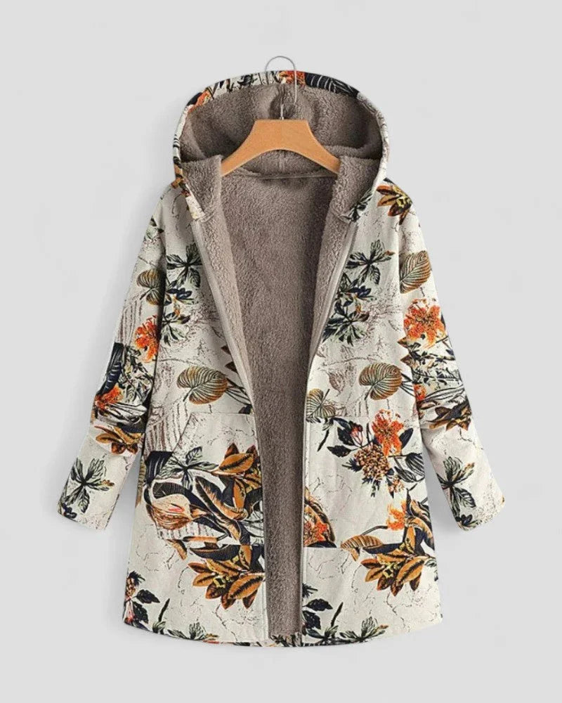 Komfortabel dame fleecejakke med hette, perfekt som casual vårjakke eller lagvis høstjakke med blomstermønster.