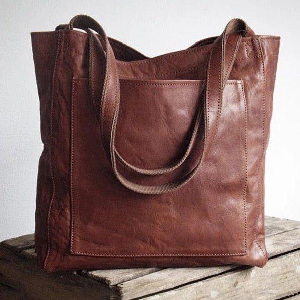 Kvinne bærer moderne skulderveske. Elegant dameveske med justerbar rem, perfekt for urban stil.