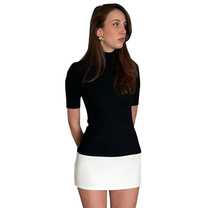 Kvinners patchwork turtleneck bodycon-kjole i sort/hvitt med halv erme. Elegant, figursydd damemote for fest og kontor.