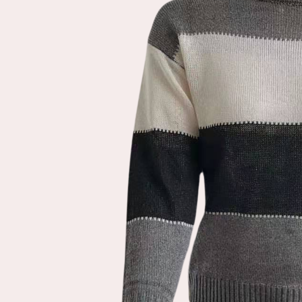 Detaljbilde av myk, strikket stripet genser for kvinner. Tidløs eleganse og mote.