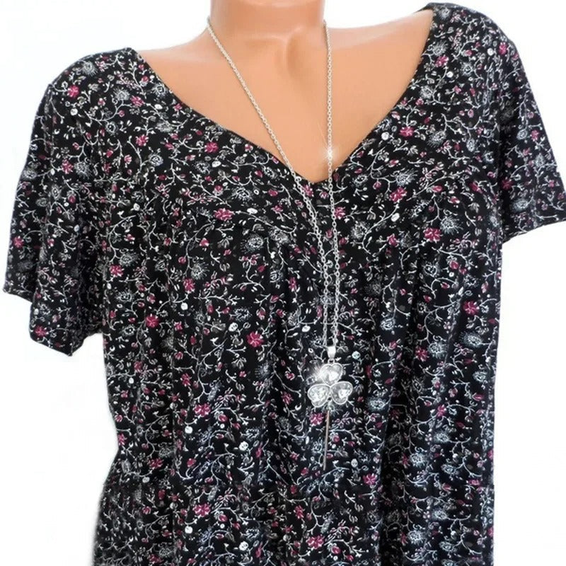 Stilren V-hals tanktopp for kvinner med flytende løs passform og sjarmerende blomstertrykk.