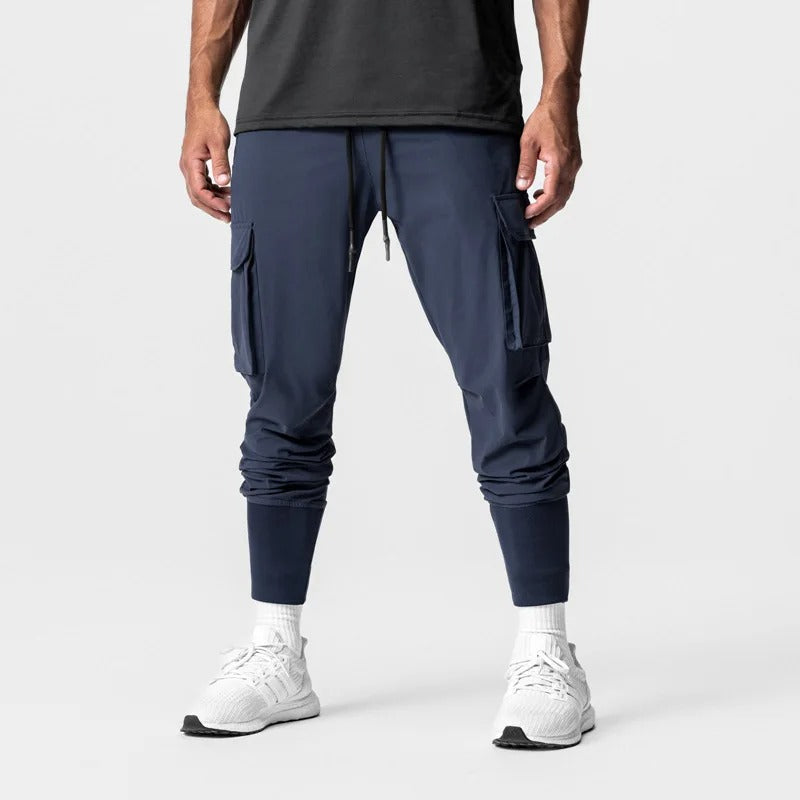 Funksjonell løpebukse for menn. Lettvekts design og quick-dry stoff, ideell for utendørs løping og trening.