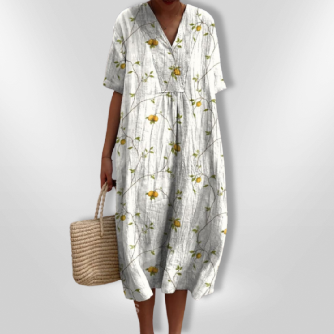 Damekjole med blomstertrykk og V-hals, en komfortabel og stilfull sommerkjole med løs passform.