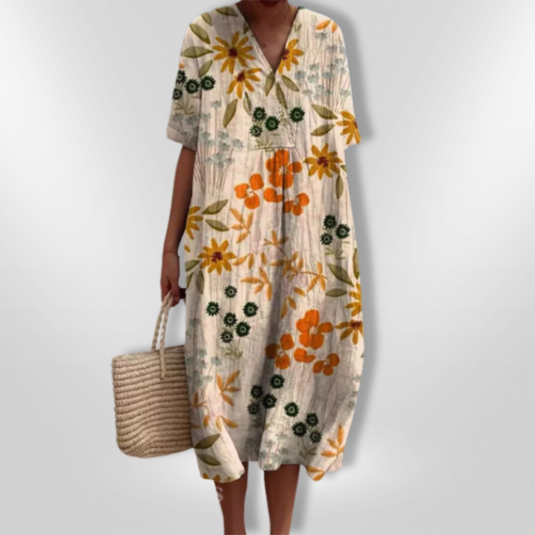 Damekjole med nydelig blomsterprint og dyp V-hals, løs passform for maksimal komfort.