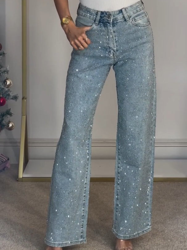 Stilige damejeans med høy midje, flatterende silhuett og subtile glitrende detaljer for enhver anledning.