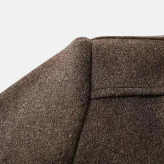 Nærbilde av stoffet på en klassisk mørkeblå herre rock, kvalitetsmateriale, justerbar komfort