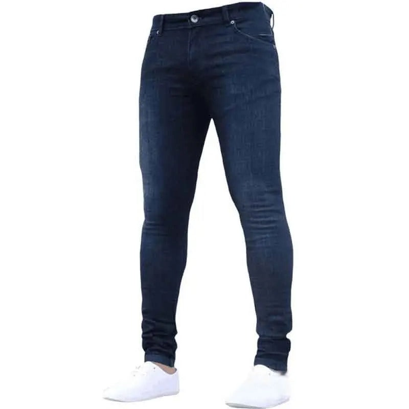 Mann kledd i grå menns skinny jeans, fremhever den moderne passformen og stretchmaterialet.