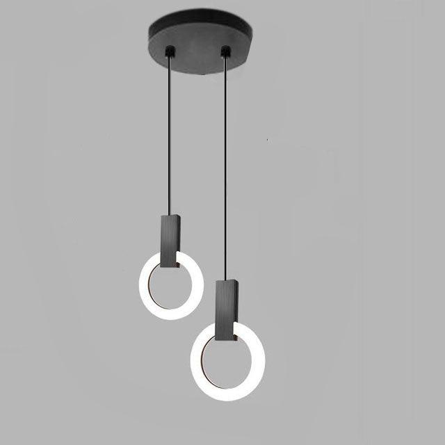 "Minimalistisk LED-pendellampe i sirkulær design, gir varm belysning med nordisk eleganse, ideell for moderne rom."