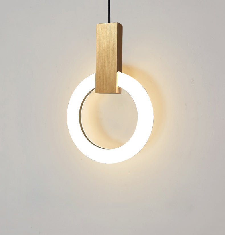 "Minimalistisk LED-pendellampe i sirkulær design, gir varm belysning med nordisk eleganse, ideell for moderne rom."
