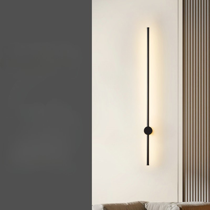 Allsidig vegglampe i minimalistisk design, passer perfekt som belysning i både stue og soverom.