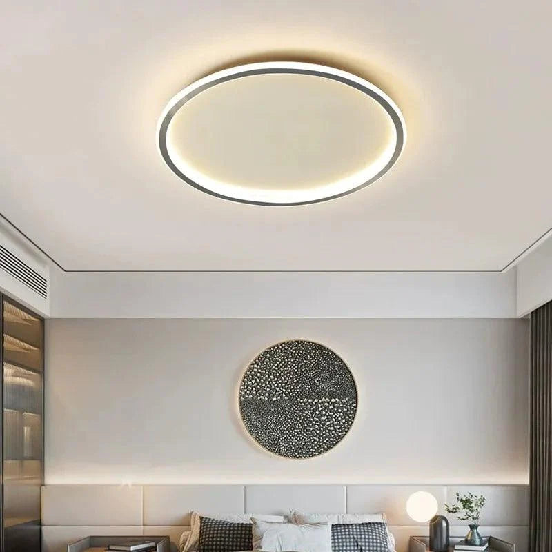 Stilren grå taklampe i minimalistisk design; moderne LED-lampe som elegant takbelysning.