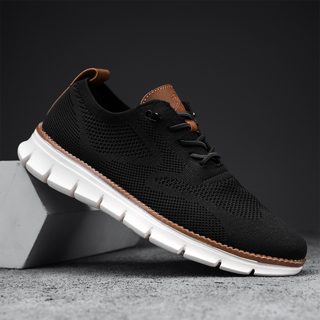 "Moderne svarte pustende sneakers for menn, lettvektsdesign med mesh, fleksibel såle for komfort og stil."
