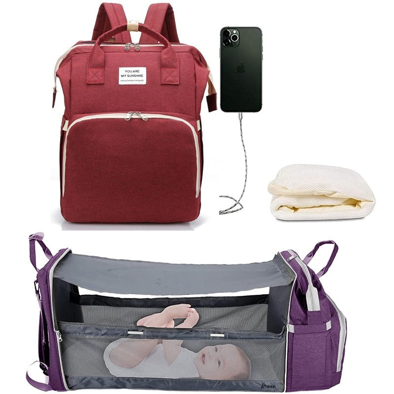 Robust bleieveske for barnevogn med integrert soveplass for baby, en multifunksjonell reiseveske for foreldre.