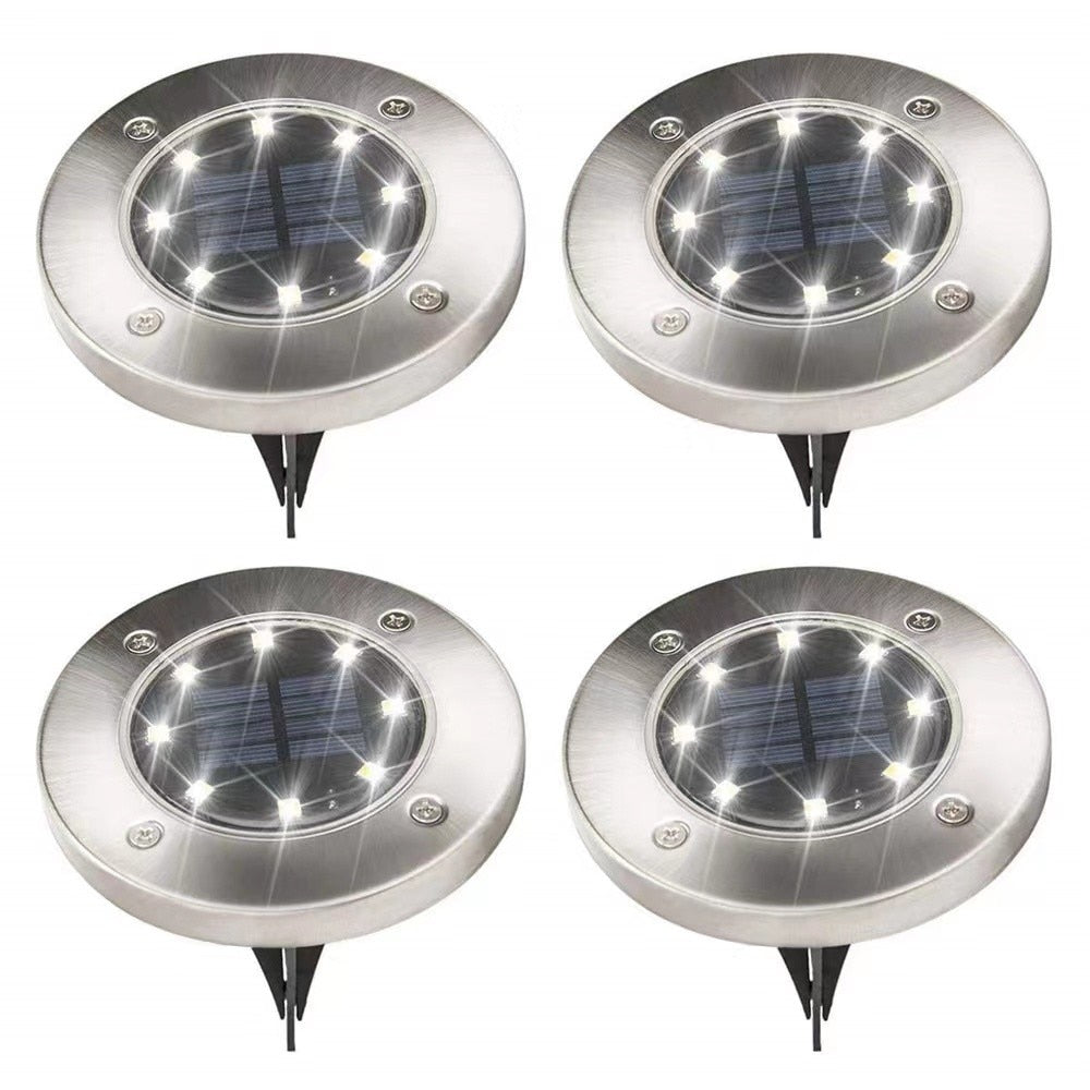 Nærbilde av Utendørs Solardisk Lys med 8 LED, viser solcellepanel og lyse LED-dioder for effektiv hagebelysning.