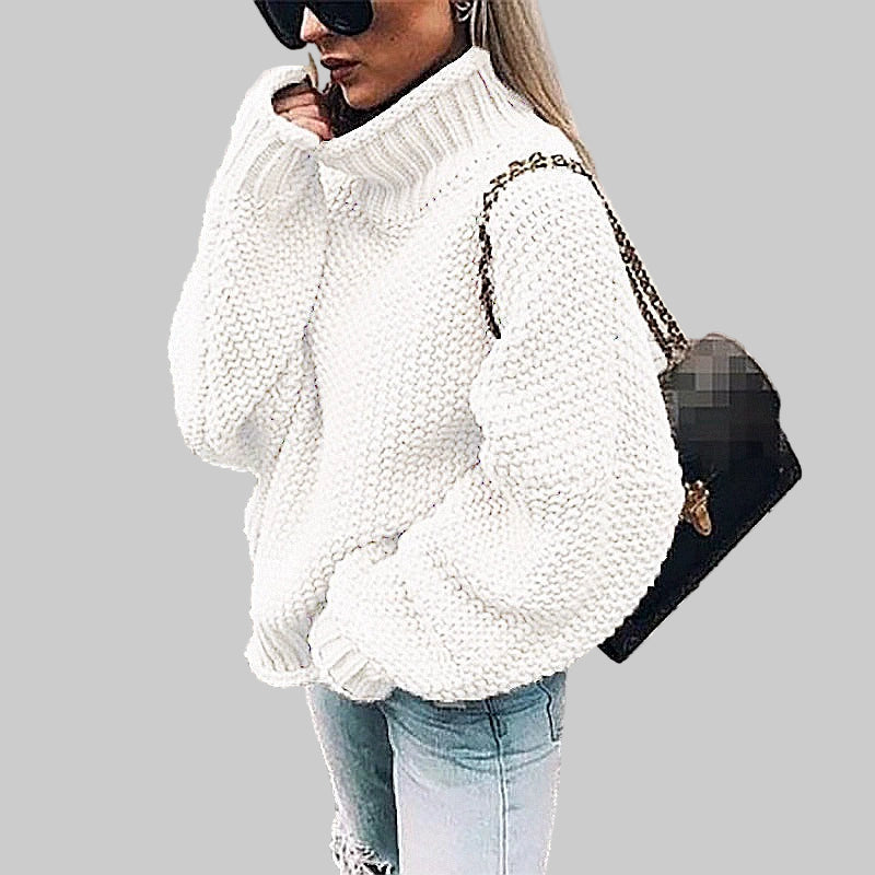Oversized dame strikkegenser med høy hals og batwing-ermer i myk chunky strikk.