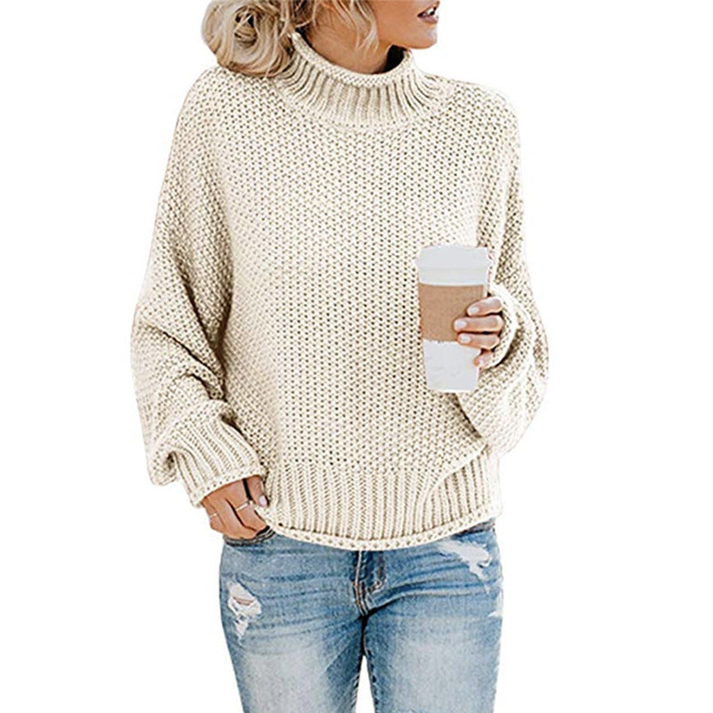 Vintermote: Oversized strikkegenser for kvinner. Høy hals, batwing-ermer, chunky strikk. Komfortabel og trendy.