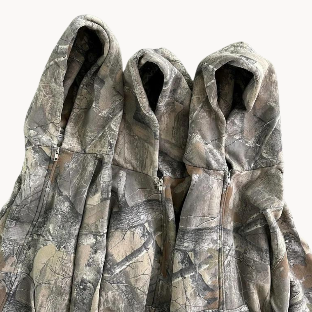Komfortabel herre hettegenser i oversized kamuflasje, myk og ideell for hverdagsstil.
