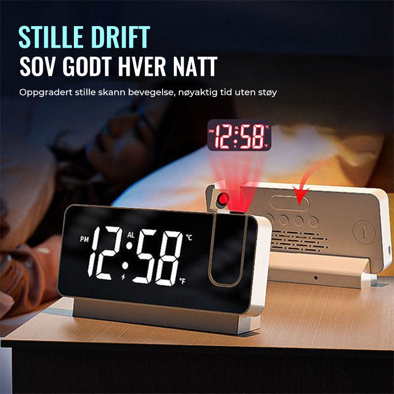 Projeksjonsklokke i elegant svart og hvitt design, viser tid på vegg/tak, med justerbar projektor og lysstyrke.