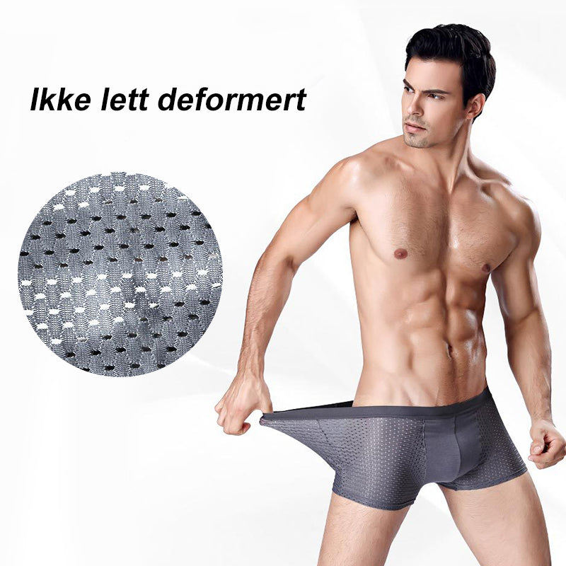 "Pustende issilke boksershorts med kjølende effekt, elegant design og bikakestruktur for optimal ventilasjon og komfort."
