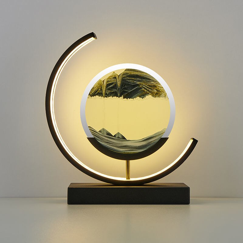 "Quicksand bordlampe med 3D-sandmaleri, elegant design i svart med dynamisk sandbevegelse, avslappende atmosfære."