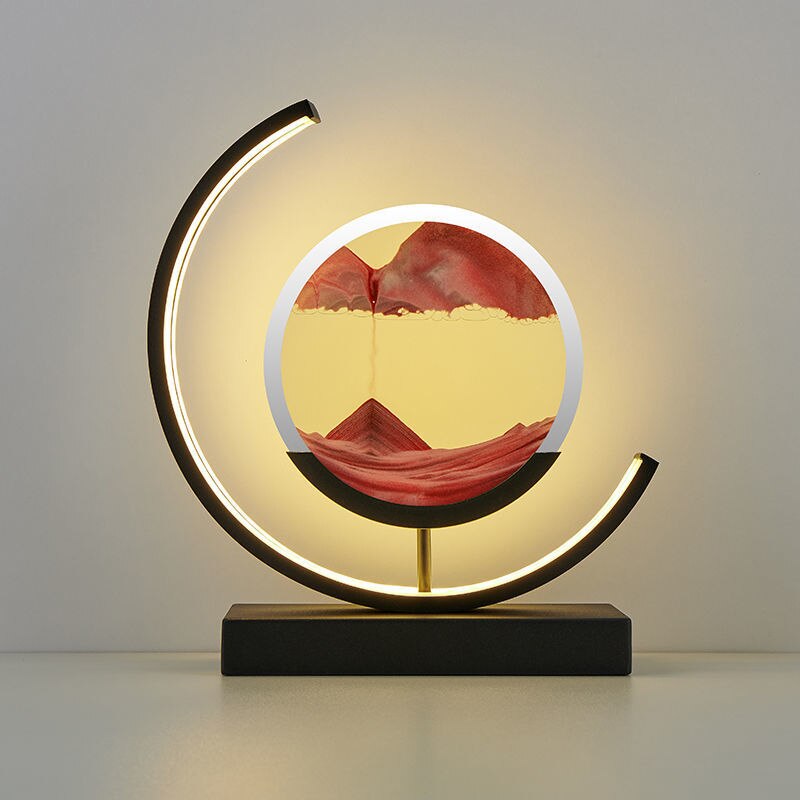 "Quicksand bordlampe med 3D-sandmaleri, elegant design i svart med dynamisk sandbevegelse, avslappende atmosfære."