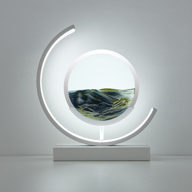 "Quicksand bordlampe med 3D-sandmaleri, elegant design i svart med dynamisk sandbevegelse, avslappende atmosfære."