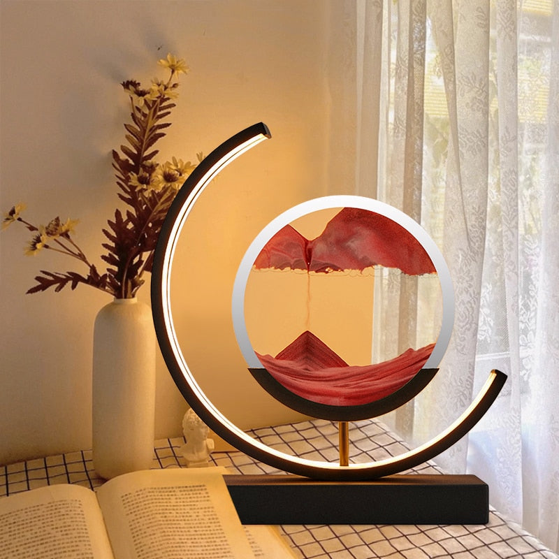 "Quicksand bordlampe med 3D-sandmaleri, elegant design i svart med dynamisk sandbevegelse, avslappende atmosfære."