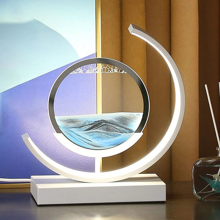 "Quicksand bordlampe med 3D-sandmaleri, elegant design i svart med dynamisk sandbevegelse, avslappende atmosfære."
