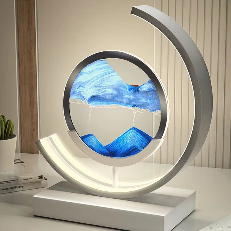 "Quicksand bordlampe med 3D-sandmaleri, elegant design i svart med dynamisk sandbevegelse, avslappende atmosfære."