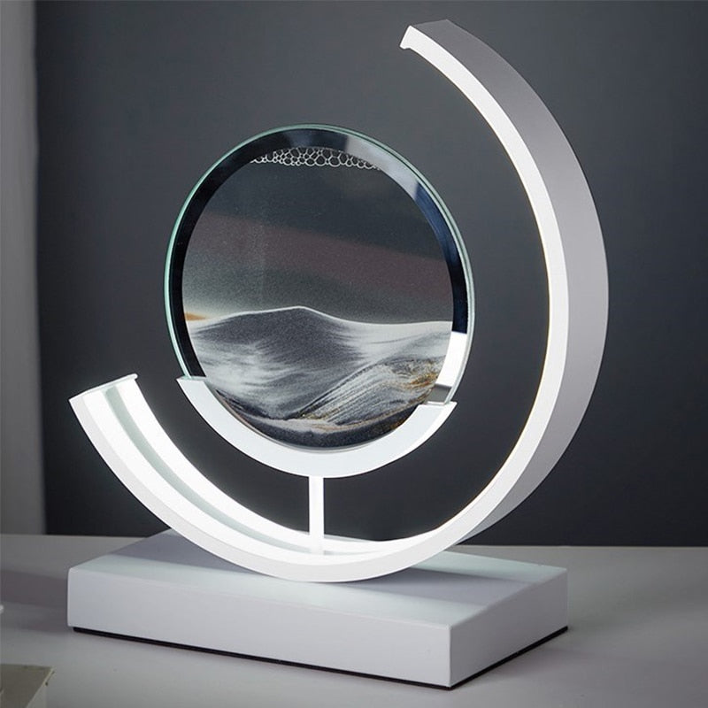 "Quicksand bordlampe med 3D-sandmaleri, elegant design i svart med dynamisk sandbevegelse, avslappende atmosfære."
