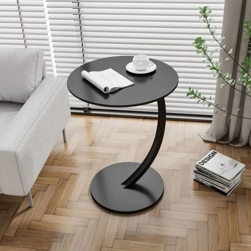 Funksjonelt rundt sidebord med moderne design, optimalt for fleksibel bruk og dekor.