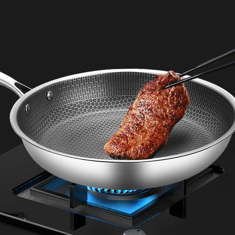 "Rustfritt stål stekepanne med non-stick pixelteknologi, elegant design, og ripefri overflate for optimal varmefordeling."