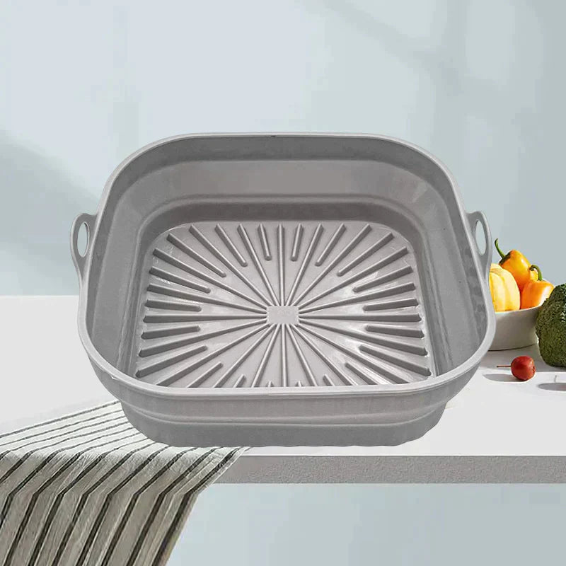 "Sammenleggbar silikongrillpanne for matlaging. Rød, plassbesparende design. Perfekt til airfryers og ovn."