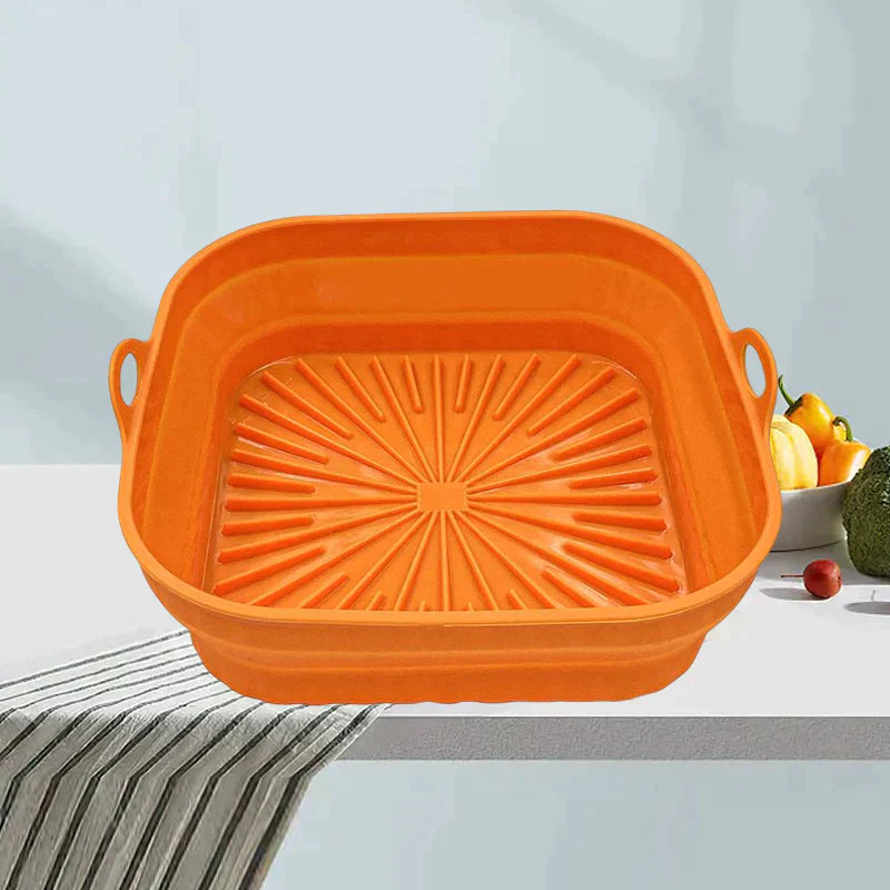 "Sammenleggbar silikongrillpanne for matlaging. Rød, plassbesparende design. Perfekt til airfryers og ovn."