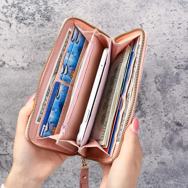 Slank lang clutch-lommebok for kvinner, perfekt for å bære i hånden eller vesken, med glidelås.