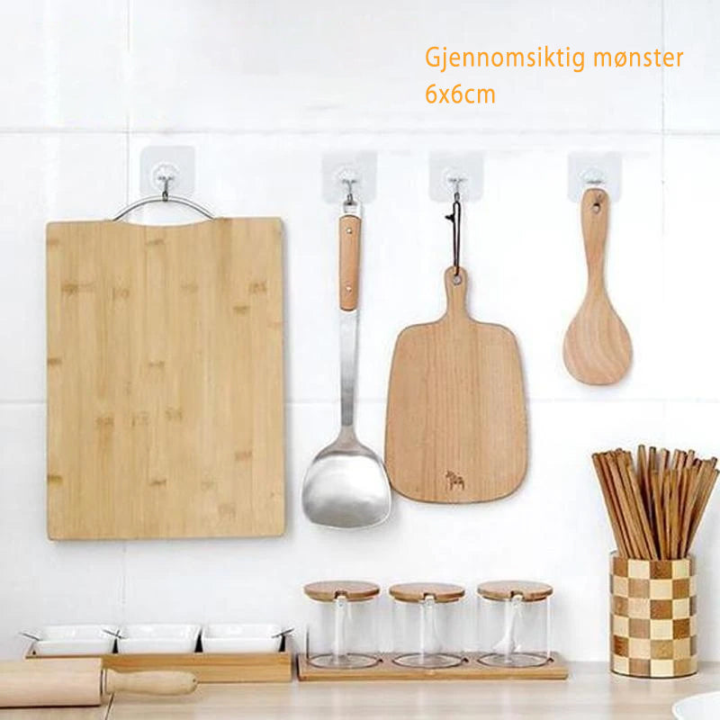 "Sømløs, selvklebende krok i rustfritt stål og transparent PVC; perfekt for glatte overflater i moderne hjem."