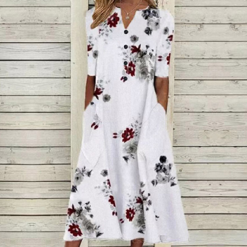 Sommerkjole med blomster- og sommerfugltrykk, A-line snitt, V-hals, lommer, elegant og praktisk design, perfekt for varme dag