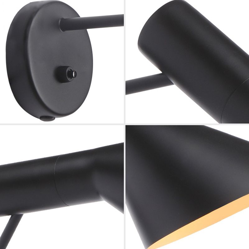 Minimalistisk sort vegglampe i kjegledesign montert på veggen i en moderne stue, elegant belysning