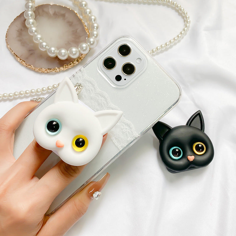 "Søt 3D Cat-telefonholder med minispeil i gull og blå øyne; hvit telefonholder med dekorativ kattedesign."
