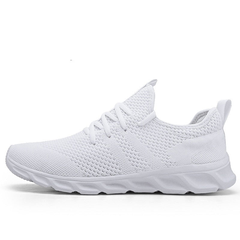 Sideprofil av herre joggesko, fremhever slank design og tykk, støtdempende såle.