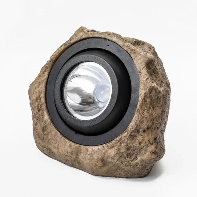 "Steinformet solcelledrevet LED utelys, naturlig design, perfekt for hager og terrasser, miljøvennlig og stilfull."