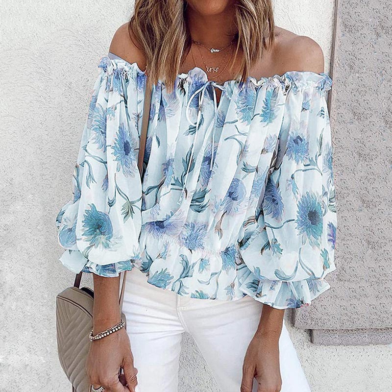 Elegant blomstret off-shoulder topp med volanger for dame. Ideell festtopp eller stilig hverdagsbluse.