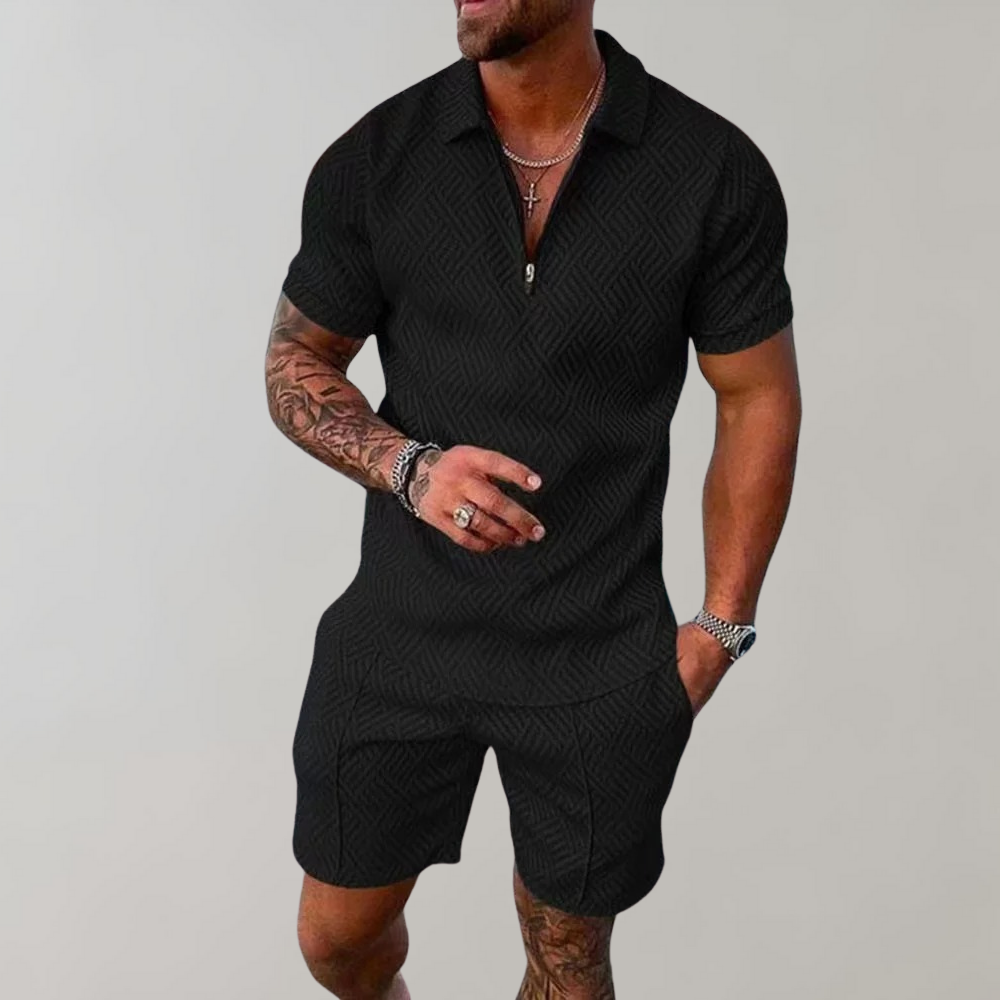 "Stilig poloshirt og shorts for menn i marineblå, perfekt for sommeren med komfortabel passform og elastisk midje."