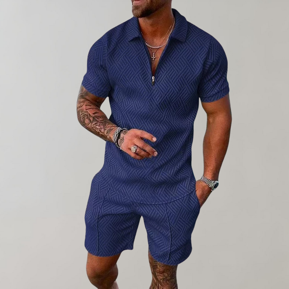"Stilig poloshirt og shorts for menn i marineblå, perfekt for sommeren med komfortabel passform og elastisk midje."
