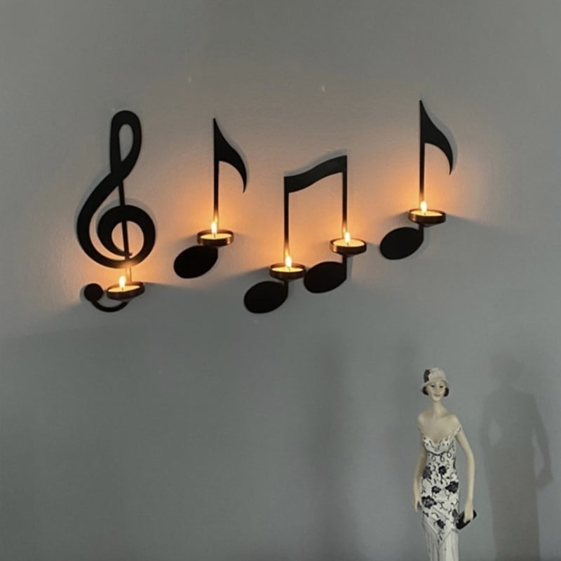 "Svart musikknote veggstake i metall, elegant design med G-nøkkel og kvartnote, perfekt for moderne hjemdekor."