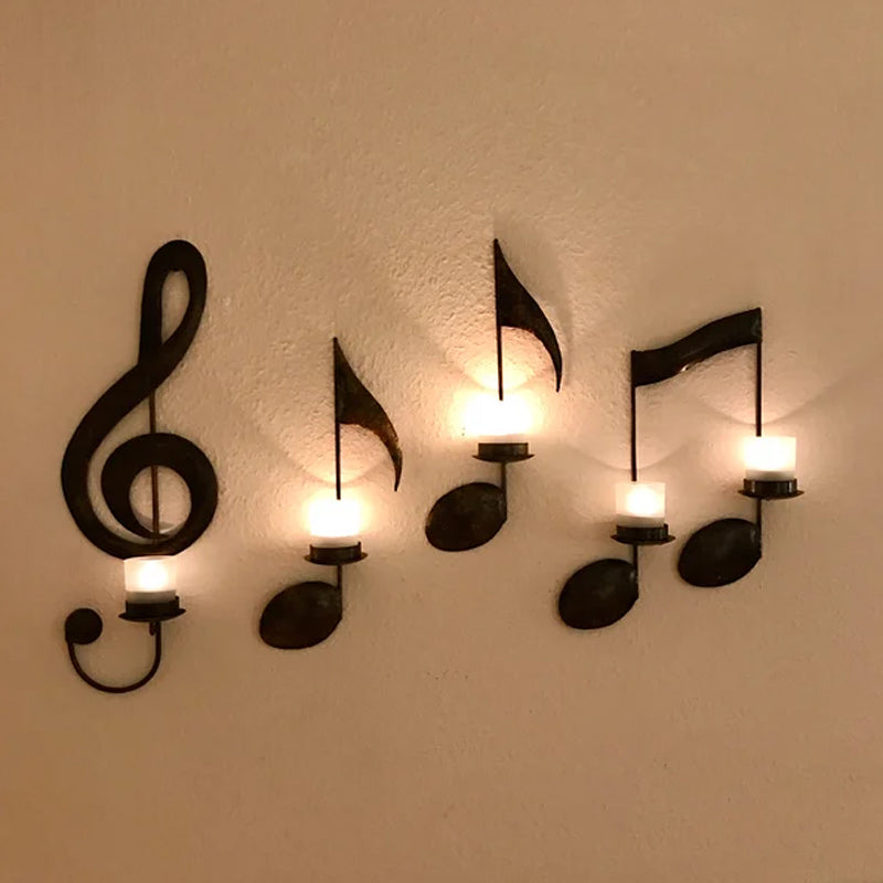 "Svart musikknote veggstake i metall, elegant design med G-nøkkel og kvartnote, perfekt for moderne hjemdekor."