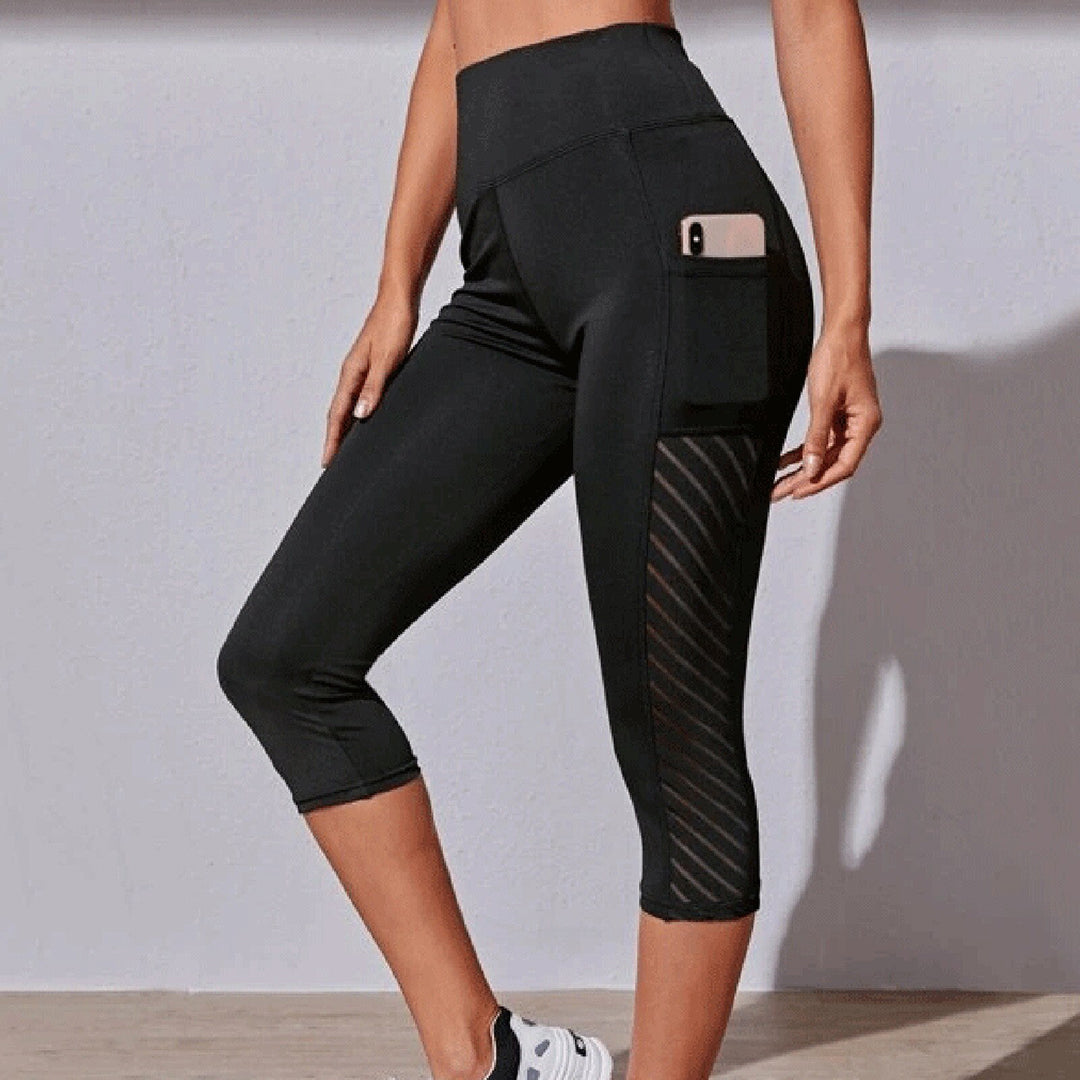 "Svarte LORA leggings for kvinner, hurtigtørkende og sømløse, fremstilt i pustende materiale for stil og komfort."